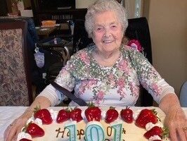 The late Sylvia Hoy celebrating her 101st birthday with a large cake.